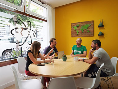 A group of people having a meeting in our meeting room